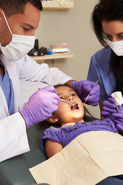 istock Young Girl Having Check Up At Dentist 175228078