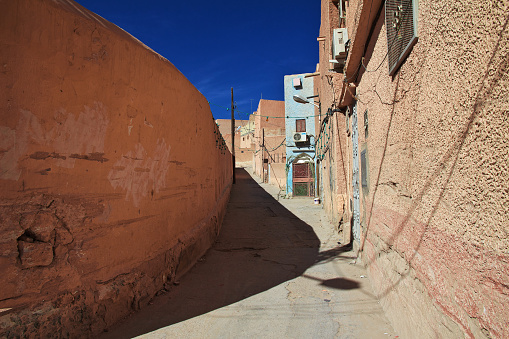 Marrakech, Morocco - December 6, 2016: Typical small street in the Medina (old town) of Marrakech, Morocco.