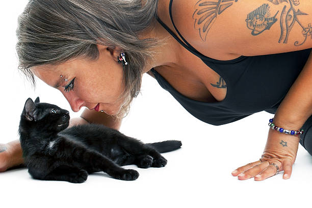 Woman with black kitten