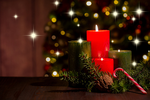 four  candles with christmas tree and decoration