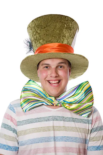 A teenager wearing a large tie and crazy hat.