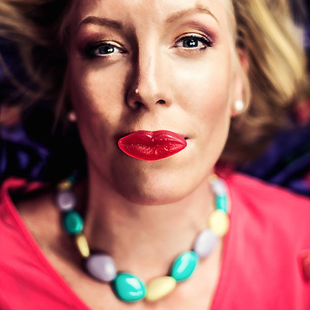 Beautiful blond woman with candy