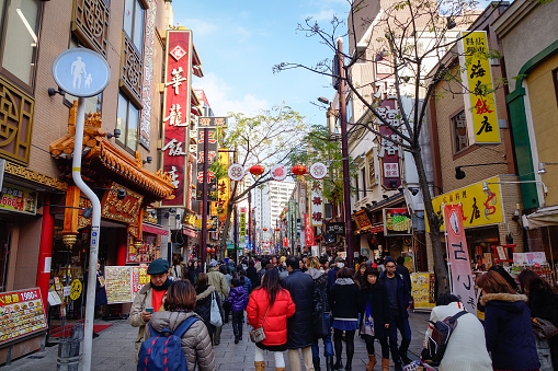 Yokohama, Japan - Dec 31, 2015. People walking on street in Chinatown, Yokohama, Japan. Yokohama Chinatown is Japan's largest Chinatown.