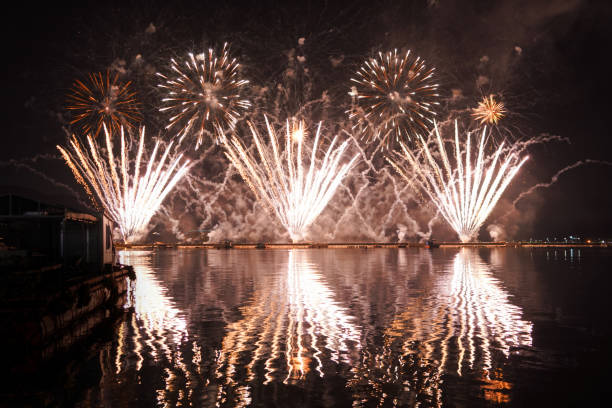 istock A colorful fire works during a celebration in the river with beautiful reflection in the water 1752310134