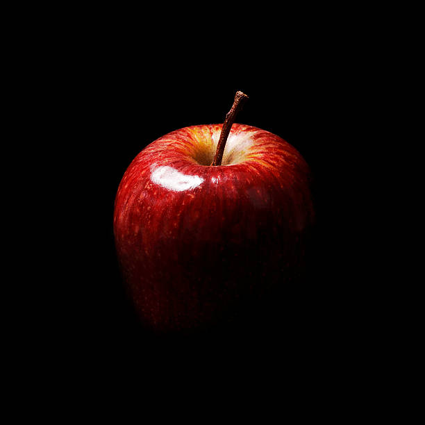 Red Christmas Apple on Black Background.
