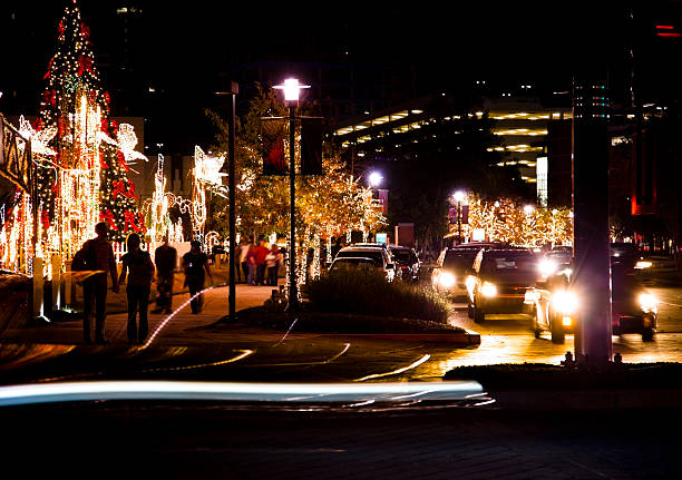 istock Multi ethnic people strolling along Christmas light decorated street 175231489