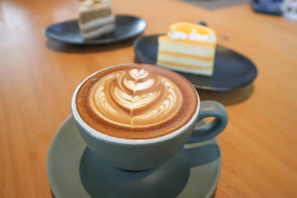 istock hot cofffee, cappuccino coffee or latte coffee or mocha coffee and cake 1752319298