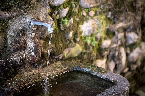Traditionally italian mountain stone fountain.
