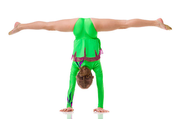 Gymnast girl isolated on white