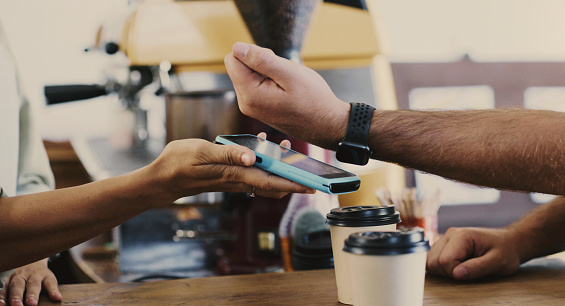 Smart watch, hands and coffee payment with machine, finance and cashless banking online. Cafe, closeup and customer pay on nfc, contactless ecommerce and digital transaction with espresso and tea