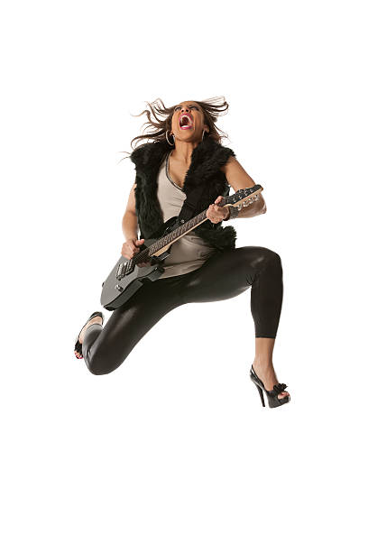 istock Excited young woman playing guitar 175232575