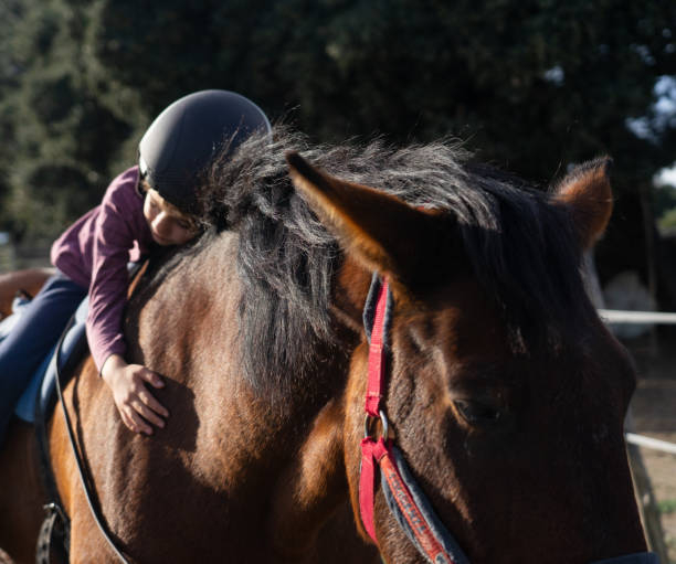 istock Boy on a horse hugging him 1752331761