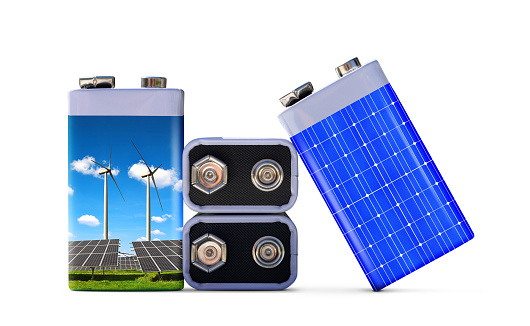 Battery with solar panels and wind turbines isolated on white background. The concept of sustainable resources or green energy.