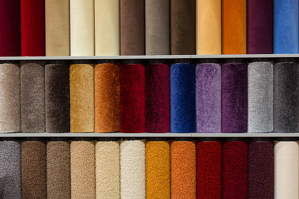 Carpet Sample Samples of colorful carpets on the shelves in the store carpet sample stock pictures, royalty-free photos & images