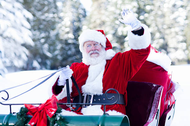 Santa Claus in His Sleigh Waving stock photo