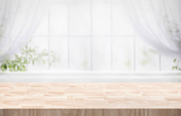 istock Selective focus.Wood table counter on blur curtain window in morning backgroun 1752335528