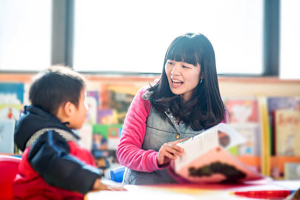 istock teacher and child in classroom 175233586