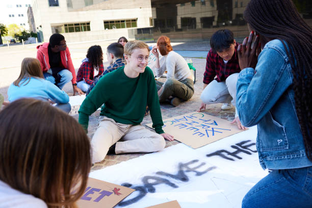 istock Diverse teen students creating banners for protest 1752336223
