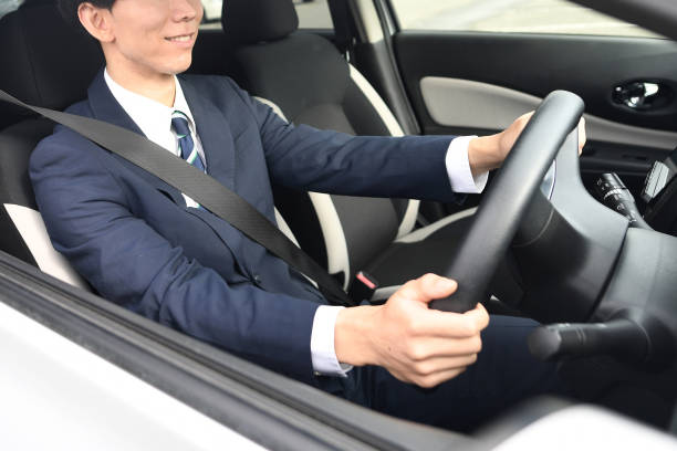 istock Asian male driver wearing a suit and driving 1752336387