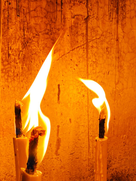 istock Many candle flames glowing in the dark, create a spiritual atmosphere 1752336682