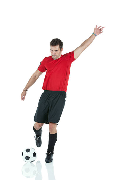 istock Soccer player kicking a ball 175233941