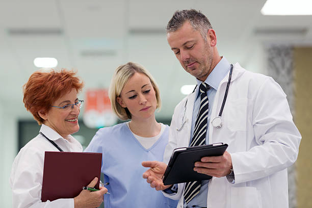 istock Team of Doctors discussing 175233946