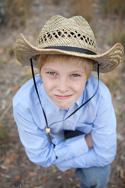 istock Pre Adolescent Boy Wearing Cowboy Hat 175234026
