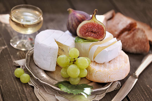 Cheese Plate Cheese Plate - selective focus plate fig blue cheese cheese stock pictures, royalty-free photos & images