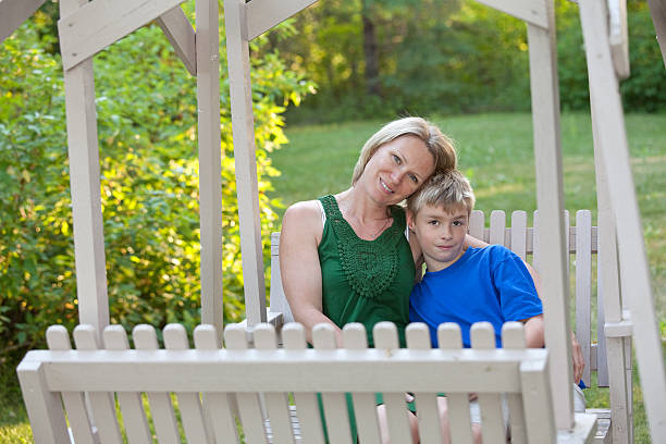 istock Woman and Boy on Rustic Country Swing 175234747