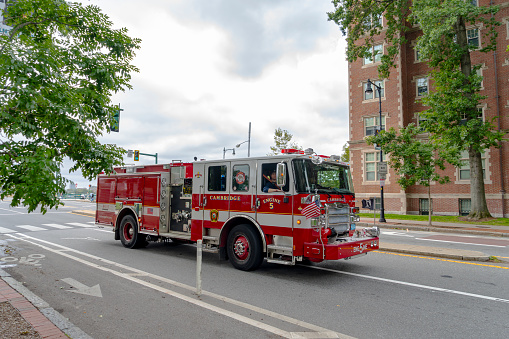 Cambridge Fire engine in Boston, Massachusetts, USA.  The Tender is attending a call out on a Boston street in the Harvard University area of Boston.