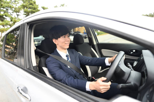 istock Asian male driver wearing a suit and driving 1752351004