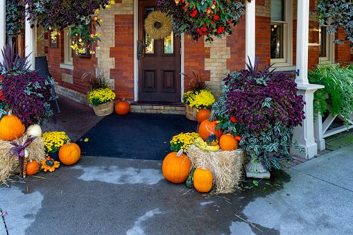 Halloween pumpkins on the doorstep of a North American home.  Niagara by the Lake, Canada.