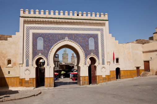 The Bab Boujeloud gate of passageway into city street in Fez, Morocco.