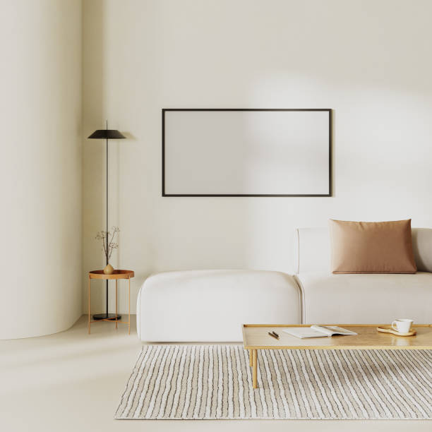istock Blank picture frame in minimalist living room interior with curvy wall, sofa with pillows and beige plasters walls,. Interior mockup, 3d render 1752353378