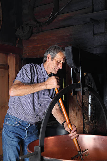 istock swiss farmer making traditional cheese in farm house 175235578