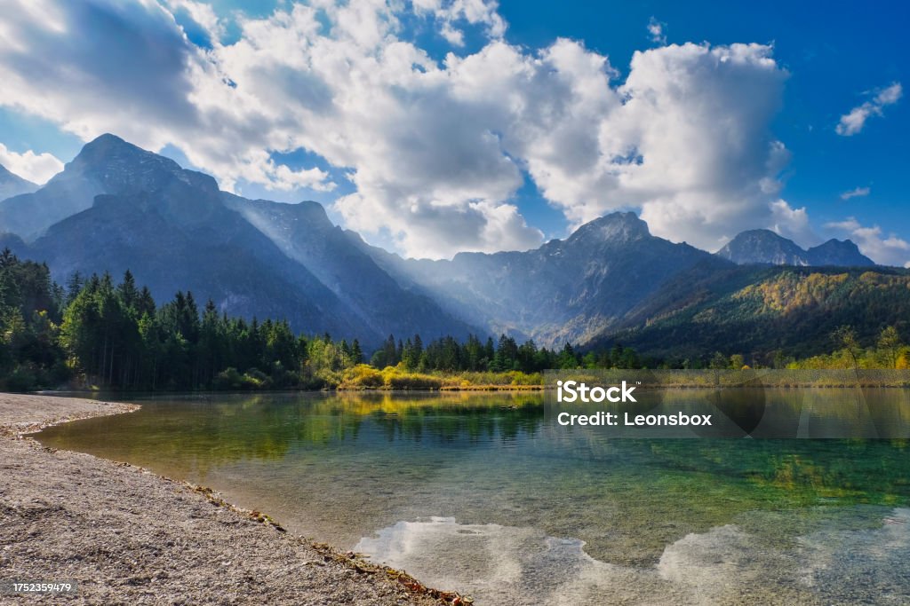 Fantastic cloud atmosphere at the "Almsee", one of the most popular natural jewels in the Upper Austrian Salzkammergut. The Almsee is a lake in the Upper Austrian part of the Salzkammergut, at the northern end of the Mountain range „Totes Gebirge“. On The Move Stock Photo