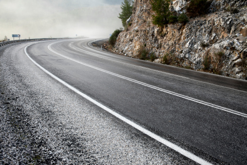 Foggy asphalt road with white lines