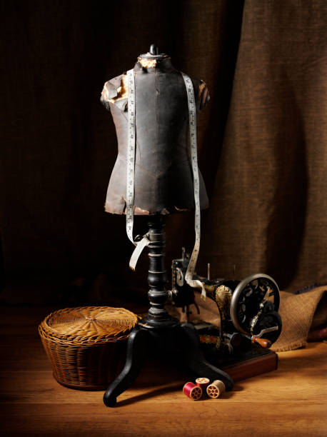 Antique dressmakers mannequin with a old sewing machine basket and other haberdashery.Click on the link below to see more of my haberdashery images.