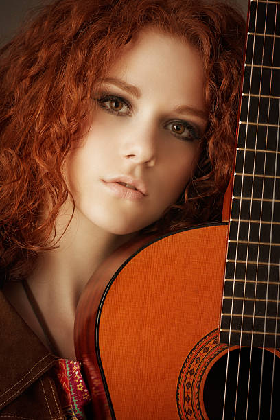 istock hippie girl with her acoustic guitar 175236377