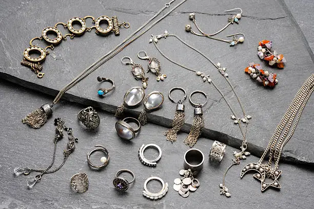 Photo of High angle view of jewelry collection on slate