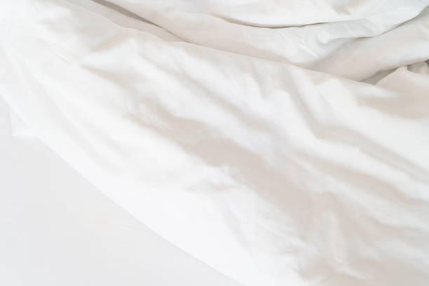 istock Unmade bed; wrinkled pillowcases, bed sheet and duvet 1752367881