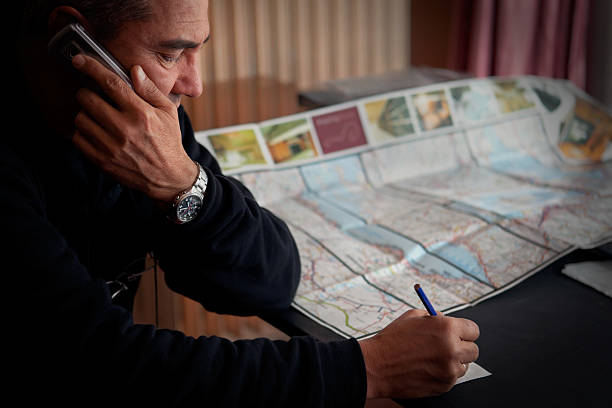 istock Man Talking on the phone and jotting 175236966