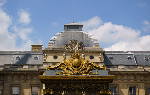 Decorated gates of Palace of Justice (French: Palais de Justice, Paris) entrance. PARIS - 29 APRIL,2019