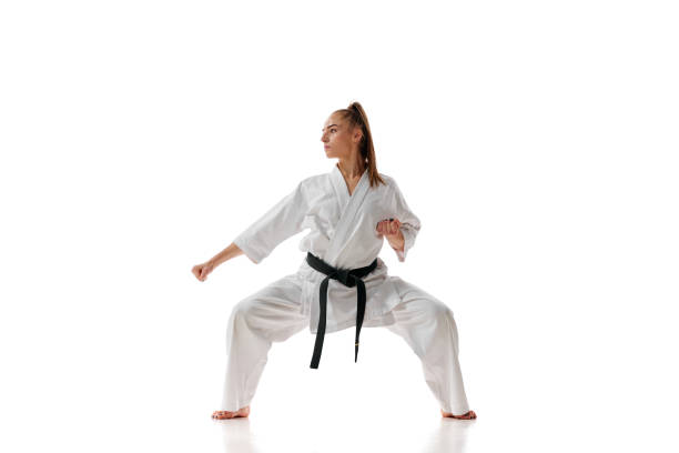 istock Master black belt Tae Kwon Do teacher with black belt standing in position isolated over white background. 1752373607