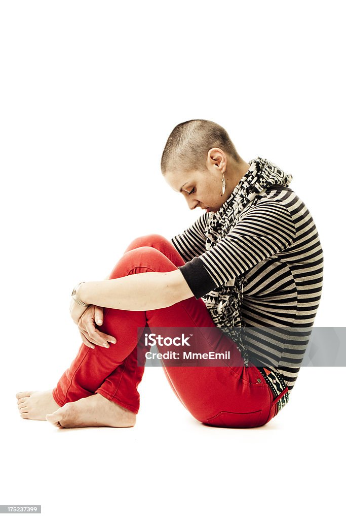 Concerned Young Woman Portrait of a sad young woman with shaved head. Side view. May be use for cancer concepts. Depression - Sadness Stock Photo