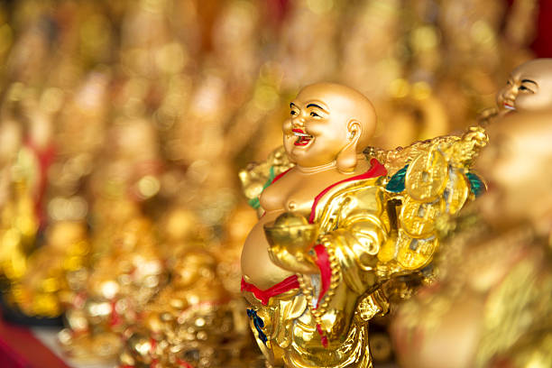 Smiling Buddha "Smiling Buddha souvenirs on the market Bangkok,Thailand" hotei the god of happiness stock pictures, royalty-free photos & images