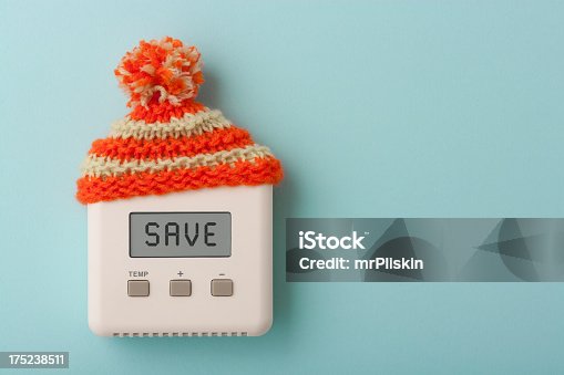 istock SAVE on digital room thermostat with wooly hat 175238511