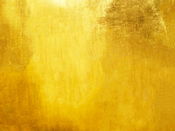 istock Old glod metal wall background or texture and shadow. 1752387233