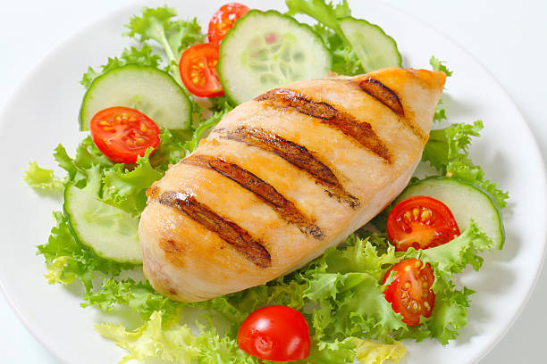 istock grilled chicken breast with vegetable garnish 175238811