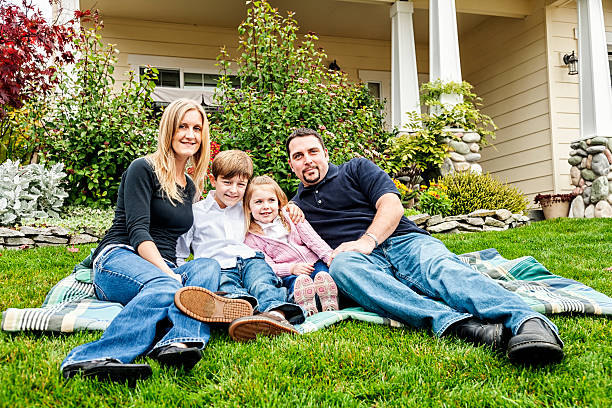 istock Happy Young Family at Home in Front Yard 175239110